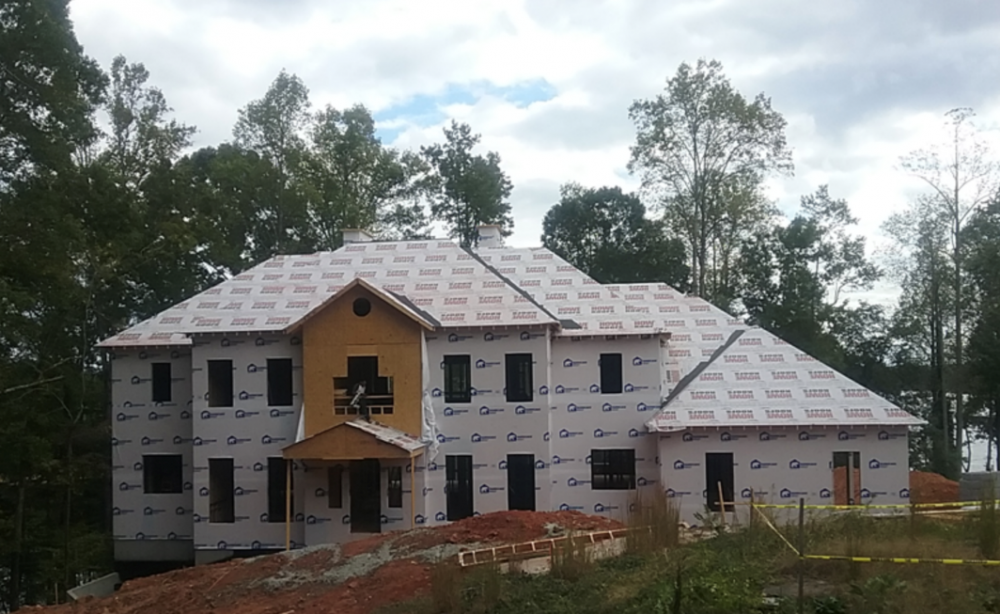 A house with trees in the background
Description automatically generated