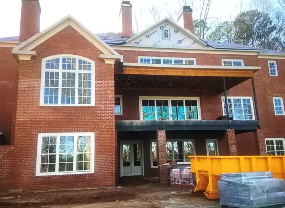 A large brick building
Description automatically generated