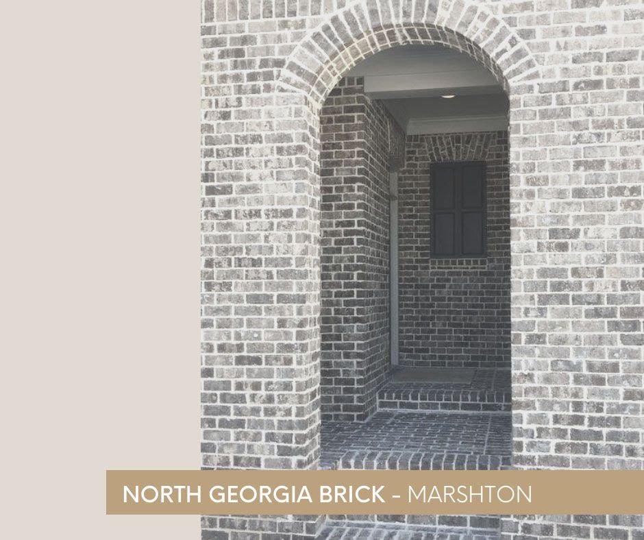 A picture containing text, building, brick, arch

Description automatically generated