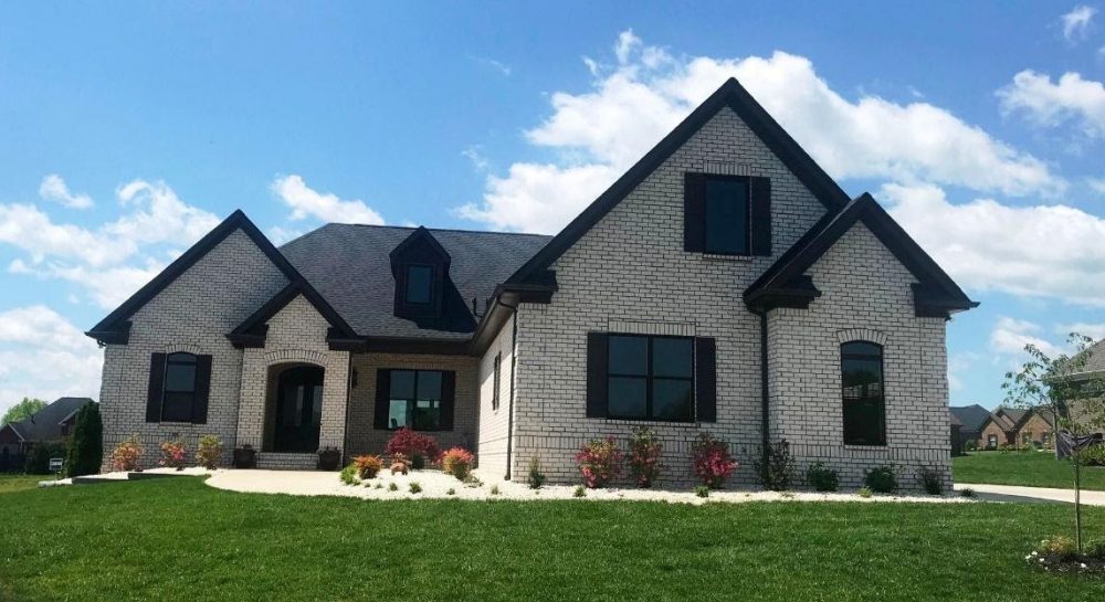 A picture containing grass, sky, outdoor, house
Description automatically generated