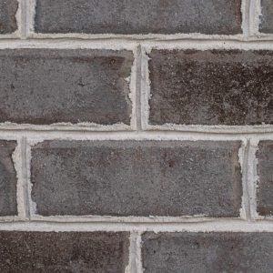 A picture containing building, brick, stone, ledge
Description automatically generated