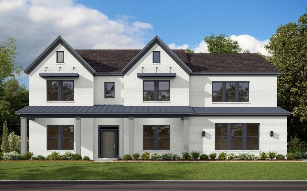 A white house with a lawn in front of it
Description automatically generated with low confidence