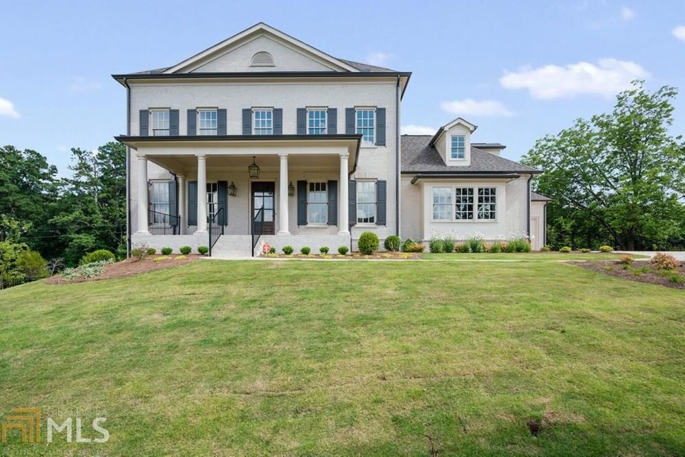 A large house with a lawn in front of it
Description automatically generated with medium confidence