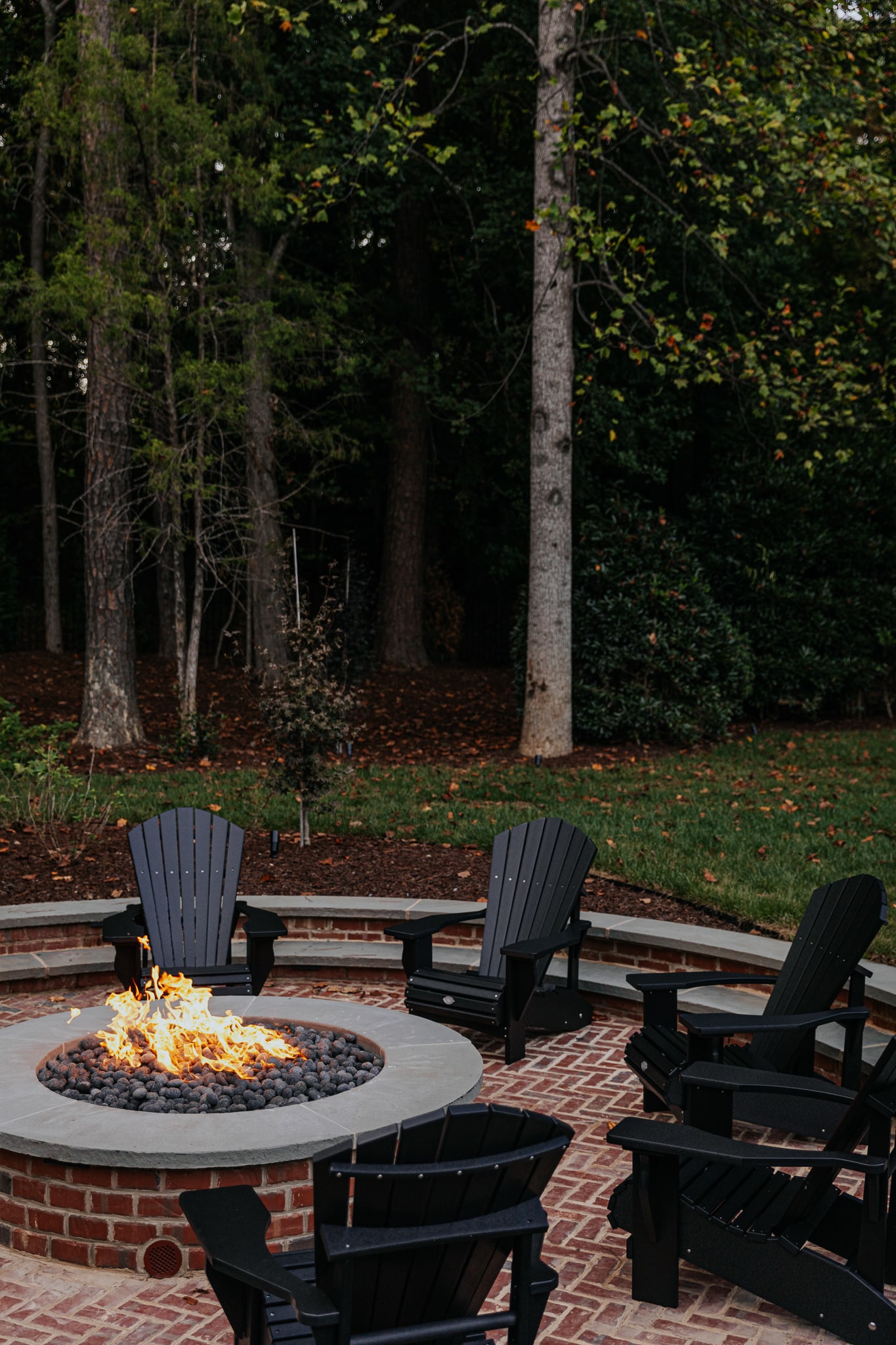 Outdoor circular brick fire pit with patio - North Georgia Brick